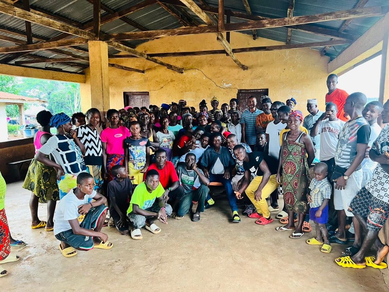 Community members gathered indoors for a CARDO agriculture meeting